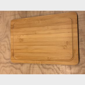 Skrebrt med egen tekst/logo  37 x 25 cm